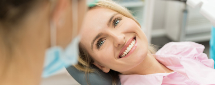 woman-smiling-in-dentist-chair